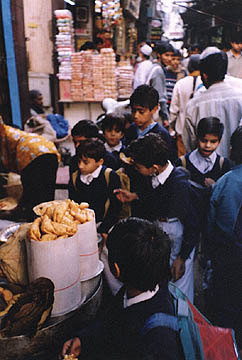 schoolboys buying samosas