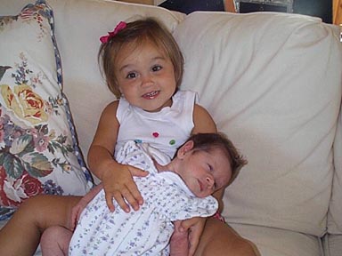 graphic image: photo of Maury's grandaughters Lane holding Meg